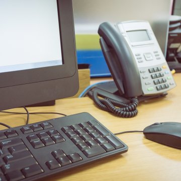 1-voip voip service voip phone computer monitor mouse keyboard phone on desk